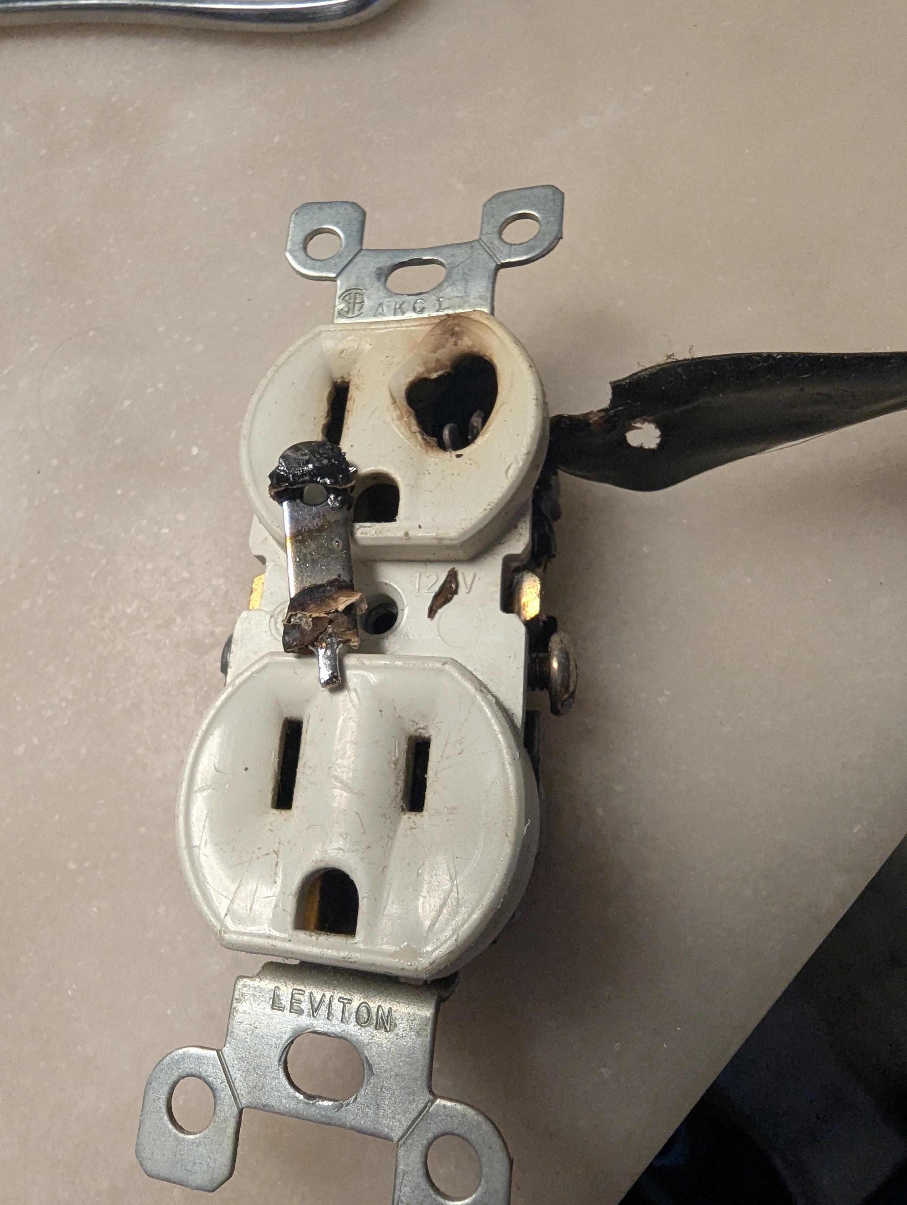 Burned electrical outlet close-up